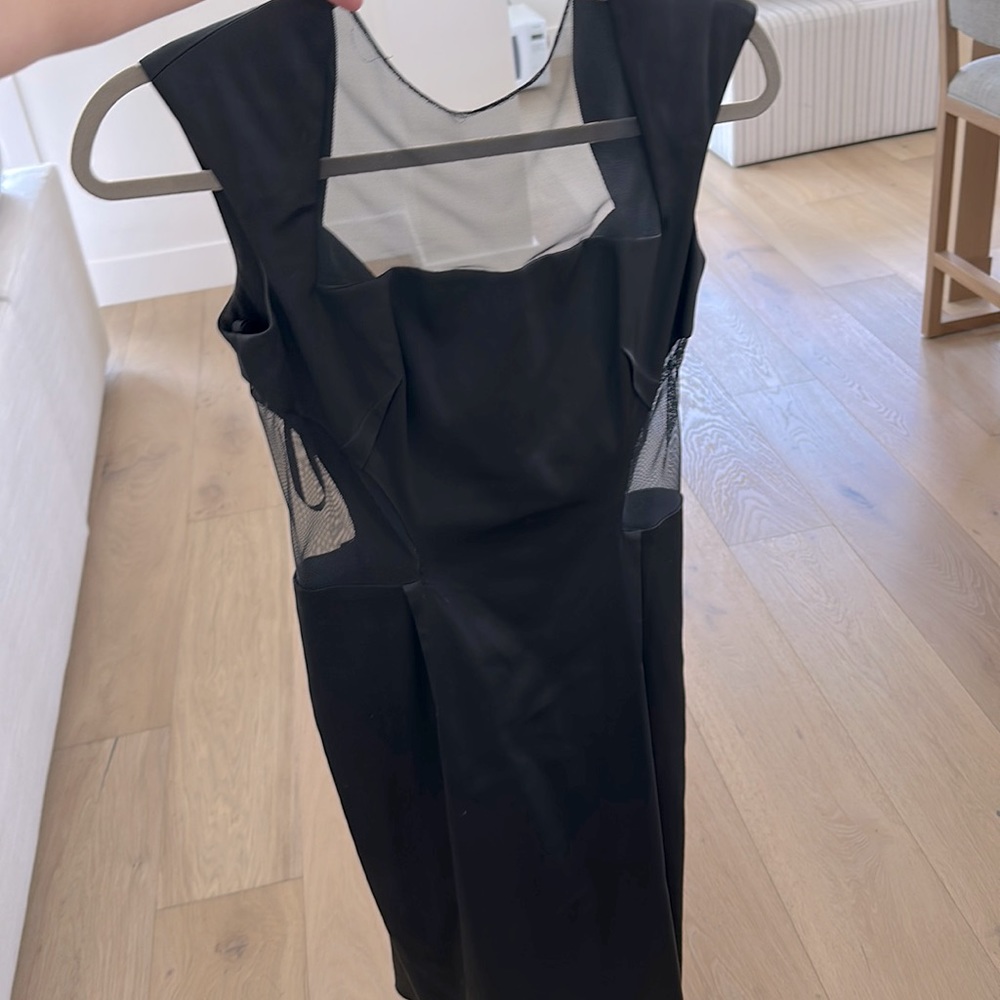 Jill Stuart black dress with sexy sheer parts at top and sides.